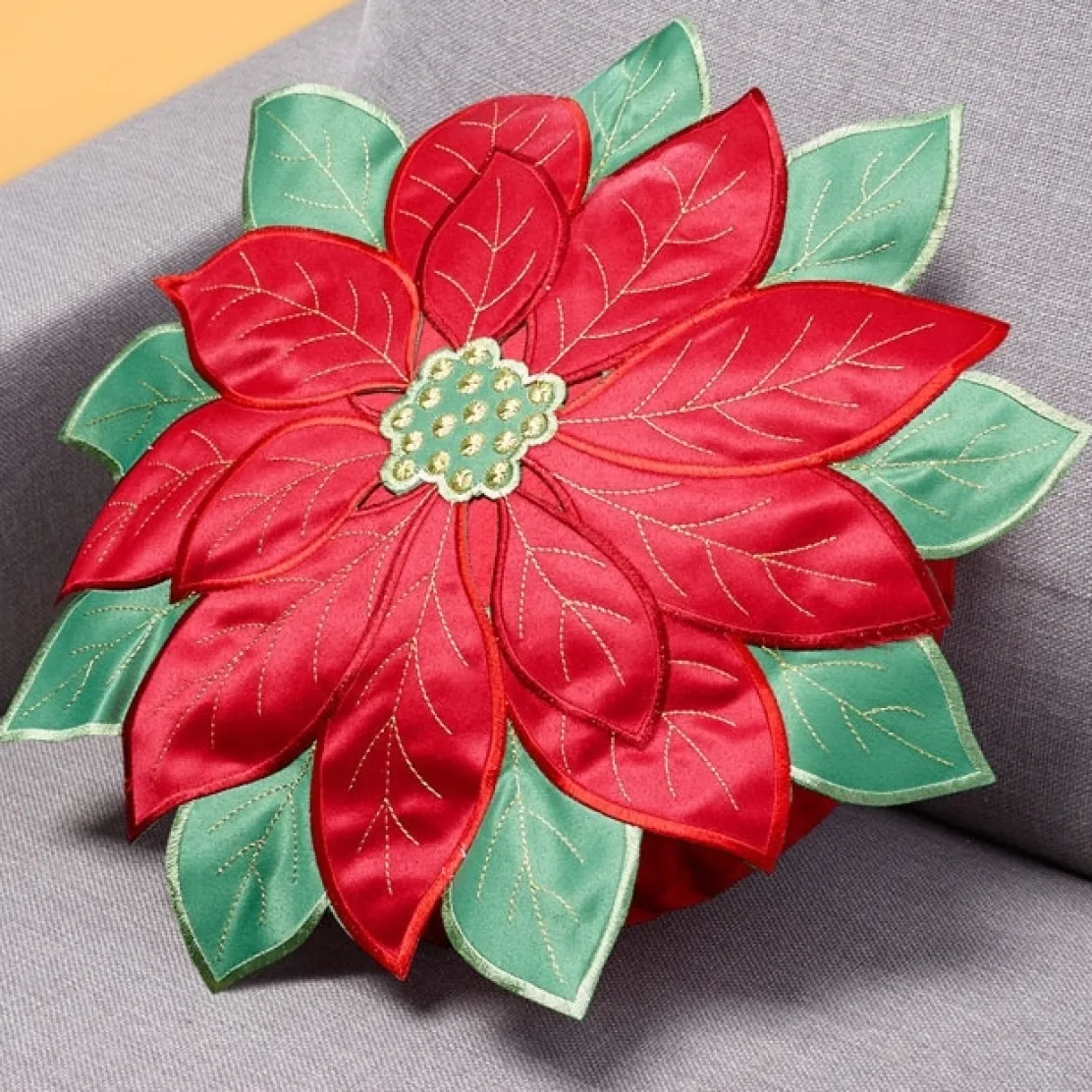 Coussin rond fleur poinsettia