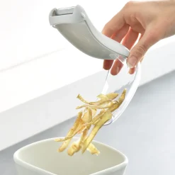 Eplucheur avec réservoir